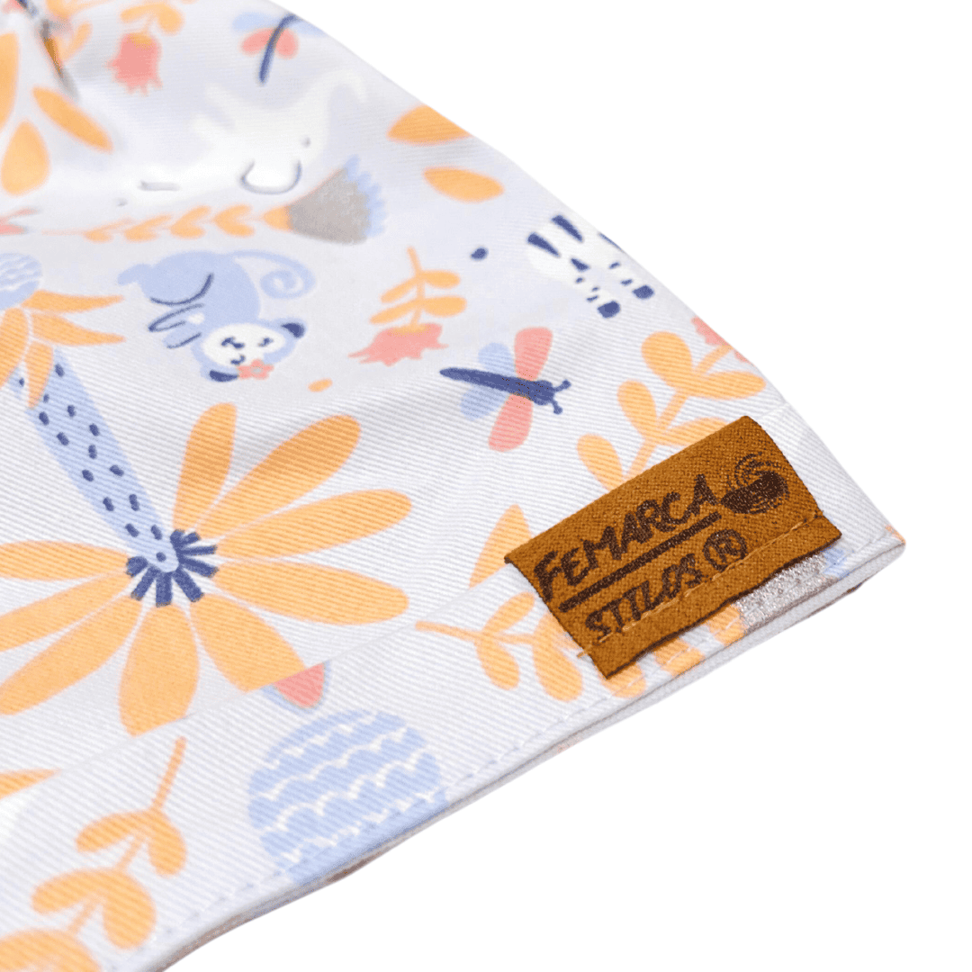 OUT|Short Niña Flores tono Naranja fondo lila